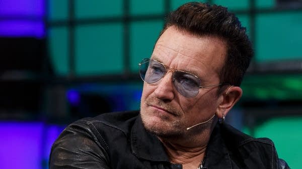 Poster U2 singer Bono appears at the 2014 Web Summit in Dublin.
