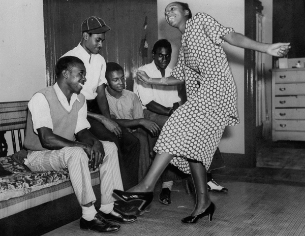 Edith Matthews shows friends and family how she won first place in the Lindy Hop in 1935.
